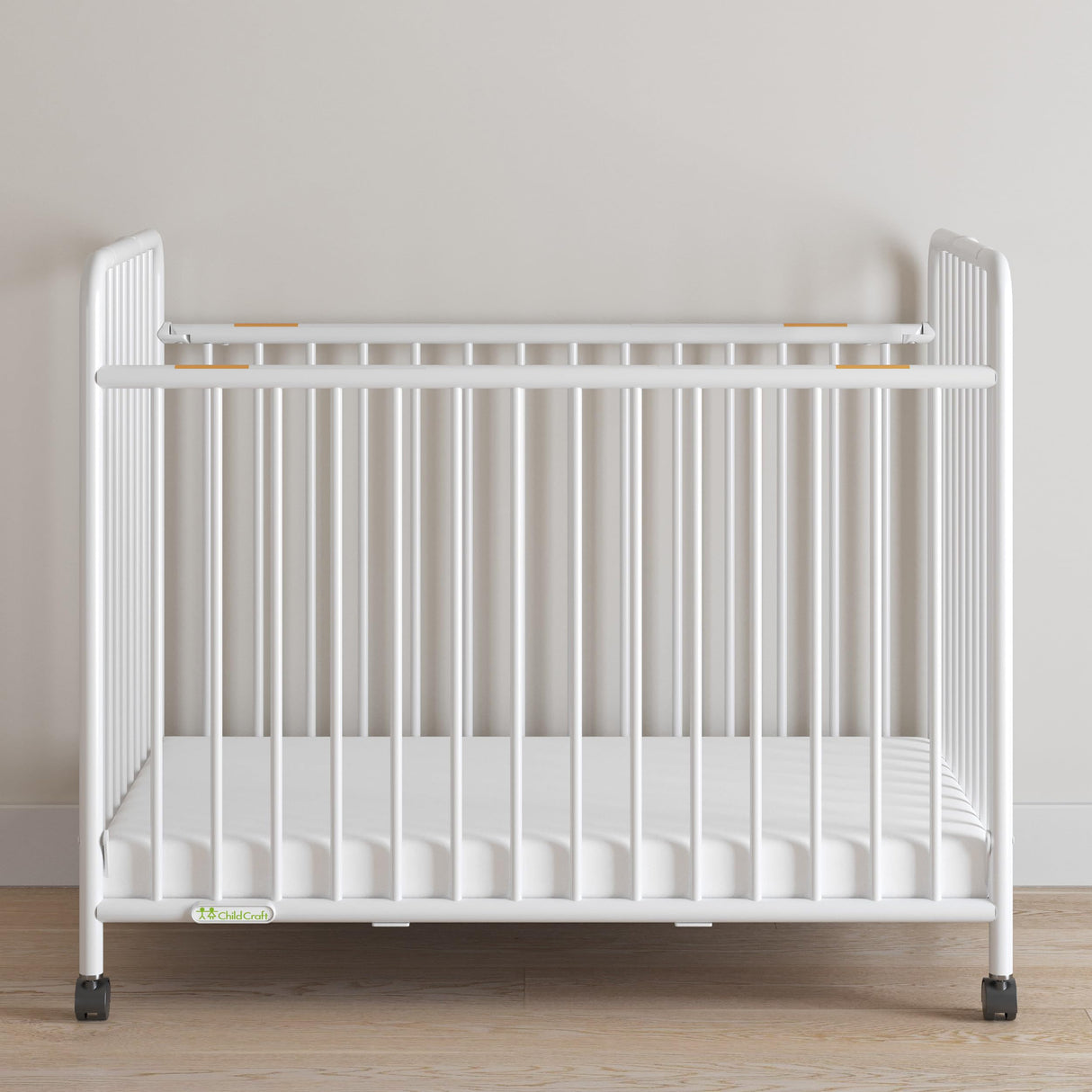 Child Craft Little Dreamer Metal Compact Folding Portable Crib with 2” Crib Mattress and 2 Easy Roll Locking Wheels, Durable Metal Construction, Easy to Clean (White) Child Craft