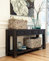 Signature Design by Ashley Gavelston Rustic Sofa Table with 4 Drawers and Lower Shelf, Weathered Black Signature Design by Ashley