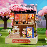 TuKIIE DIY Miniature Dollhouse Kit with Furniture, 1:24 Scale Creative Room Mini Wooden Doll House Plus Dust Proof for Kids Teens Adults(Sakura Noodles Shop) TuKIIE