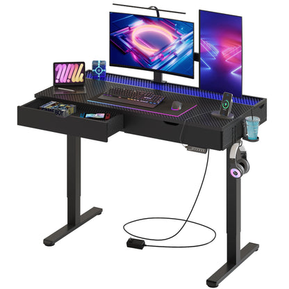 Bestier LED Electric Standing Gaming Desk with Double Drawers,47x23 Inch Standing Desk Adjustable Height with Cup Holder＆Hook,Ergonomic Rising Desk for Home Office,Black Carbon Fiber