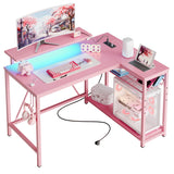 Bestier Gaming Desk with Power Outlets, 42" L-Shaped Gaming Desk with LED Lights, Desk with Reversible Storage Shelves & Hooks for Small Spaces, Bedrooms & Offices,Carbon Fiber Pink Bestier