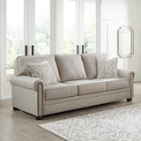 Signature Design by Ashley Gaelon Transitional Sofa with Nailheads and 2 Accent Pillows, Beige Signature Design by Ashley