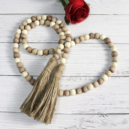 CVHOMEDECO. Wood Beads Garland with Tassels Farmhouse Rustic Wooden Prayer Bead String Wall Hanging Accent for Home Festival Decor. Mix Distressed