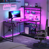 Bestier Gaming Desk with Power Outlets,42 Computer Desk with LED Lights, Reversible Corner Desk with 4-Tier Shelves,Cup Holder & Hook for Home Office,Carbon Fiber Black Bestier