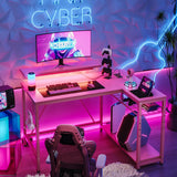 Bestier Gaming Desk with Power Outlets, 42" L-Shaped Gaming Desk with LED Lights, Desk with Reversible Storage Shelves & Hooks for Small Spaces, Bedrooms & Offices,Carbon Fiber Pink Bestier