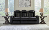 Signature Design by Ashley Caveman Den Modern Faux Leather Power Reclining Sofa with Adjustable Headrest, Drop Down Table, Electrical Outlets and LED Reading Lights, Black Signature Design by Ashley