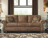Signature Design by Ashley Larkinhurst Faux Leather Sofa with Nailhead Trim and 2 Accent Pillows, Brown Signature Design by Ashley
