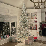Fraser Hill Farm 9-Ft. Pre-Lit Mountain Pine Snow Flocked Artificial Christmas Tree with Stand, Tall & Foldable Heavily Flocked Christmas Tree with Realistic Foliage & White Incandescent Smart Lights Fraser Hill Farm