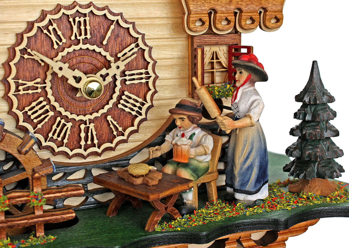 Trenkle Quartz Cuckoo Clock Black Forest House with Moving Black Forest Woman and Mill Wheel, with Music TU 4215 QM Trenkle
