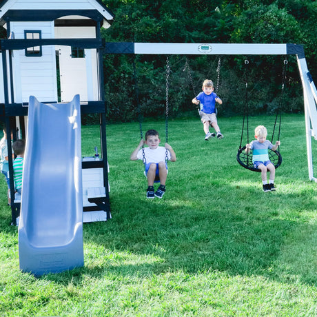 Backyard Discovery Canyon Creek White Cedar Wood Swing Set with Wave Slide, Clubhouse, Play Kitchen, Picnic Area, Belt Swings, Web Swing, Rock Wall, Balconies, Playhouse, Step Ladder, Outdoor Playset Backyard Discovery
