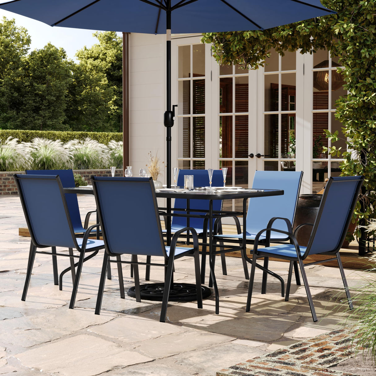 Flash Furniture Brazos 7 Piece Outdoor Patio Dining Set - 6 Navy Flex Comfort Stack Chairs - 55" Tempered Glass Patio Table with Umbrella Hole Flash Furniture