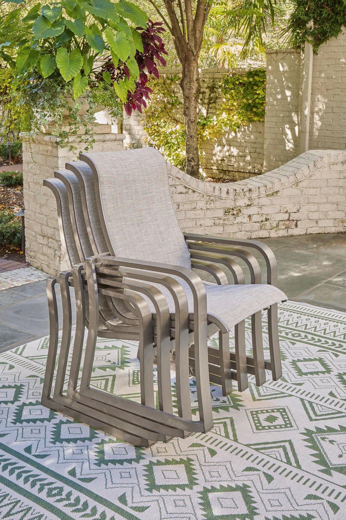 Signature Design by Ashley Beach Front Casual Outdoor Stackable Faux Leather Sling Arm Chair, Set of 4, Light Brown Signature Design by Ashley
