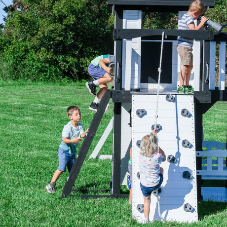 Backyard Discovery Canyon Creek White Cedar Wood Swing Set with Wave Slide, Clubhouse, Play Kitchen, Picnic Area, Belt Swings, Web Swing, Rock Wall, Balconies, Playhouse, Step Ladder, Outdoor Playset Backyard Discovery