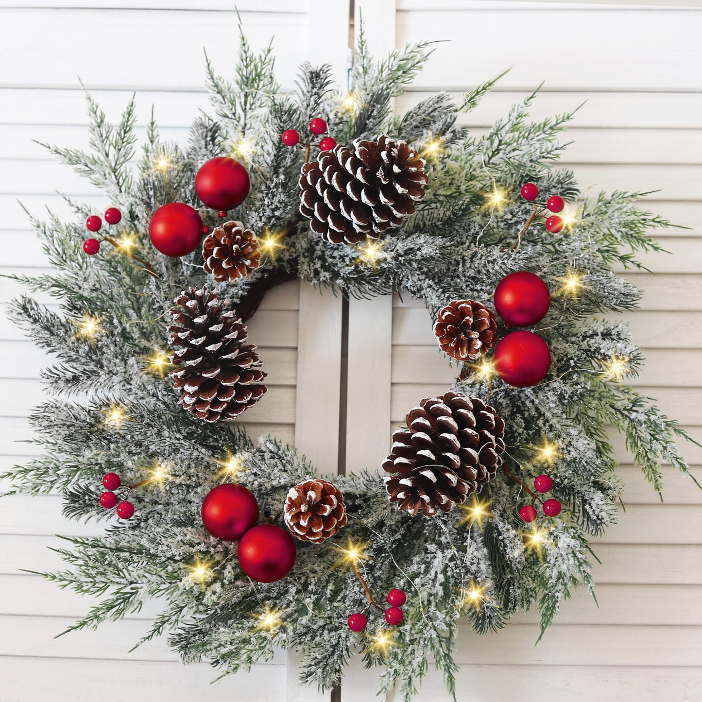 Christmas Wreath with Lights 24 Inch PreLit Christmas Wreaths for Front Door with Large Pinecones and Snowy Flocked, Battery Operated 40 LED Lights, Holiday Decoration for Fireplace Xmas Decor