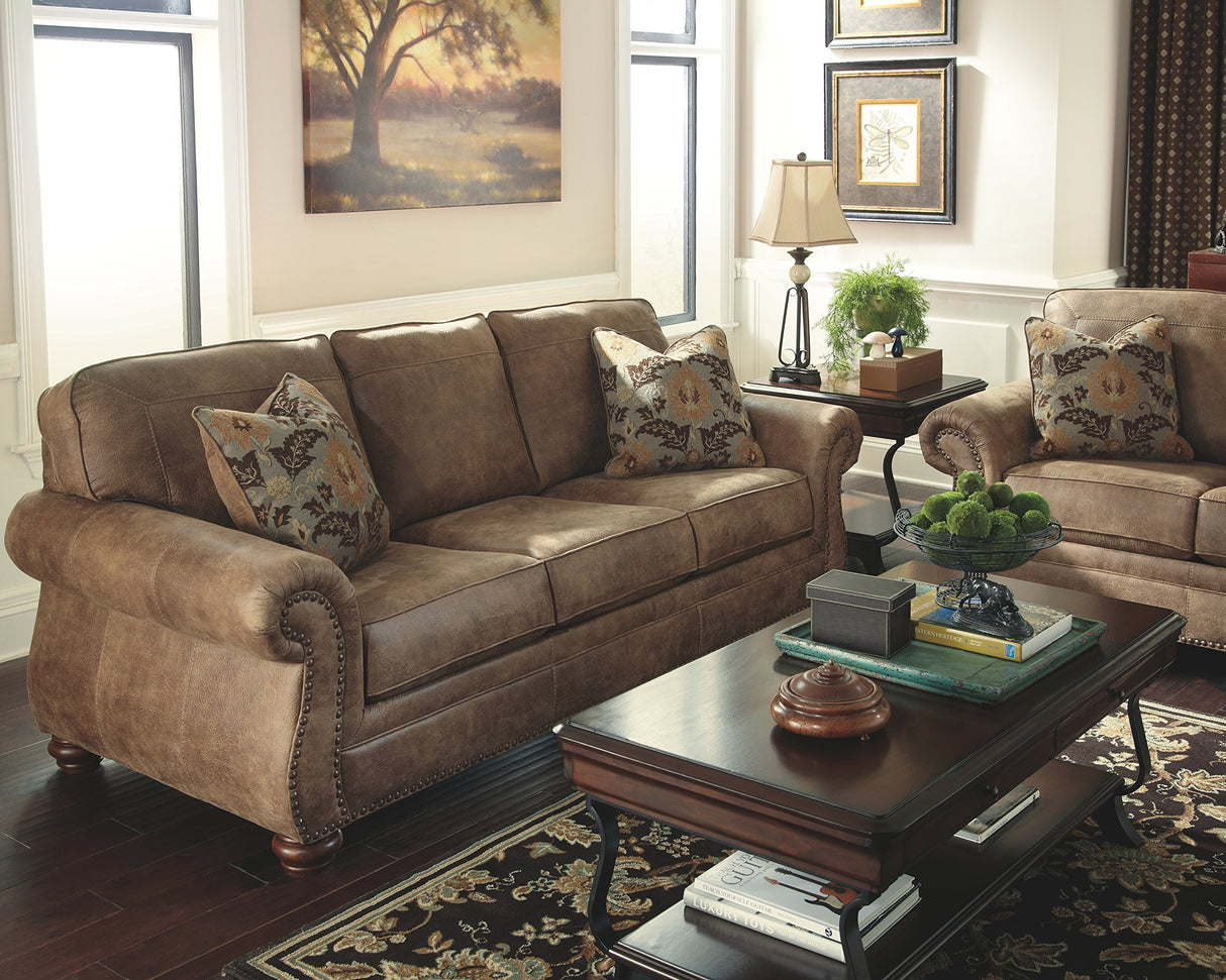 Signature Design by Ashley Larkinhurst Faux Leather Sofa with Nailhead Trim and 2 Accent Pillows, Brown Signature Design by Ashley