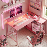 Bestier Gaming Desk with Power Outlets, 42" L-Shaped Gaming Desk with LED Lights, Desk with Reversible Storage Shelves & Hooks for Small Spaces, Bedrooms & Offices,Carbon Fiber Pink Bestier