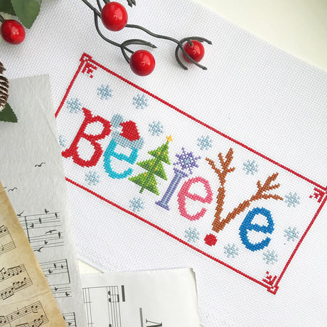 Counted Cross Stitch Kit 'Believe' - Embroidery Set for The Holidays, Encouragement, or Inspiring Everyday Possibilities with a Christmas Tree, Snowflake, Deer and Santa Hat Povitrulya