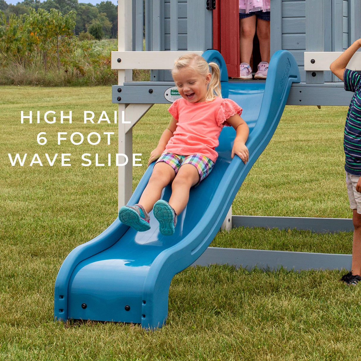 Backyard Discovery Beacon Heights Elevated Cedar Playhouse, Play kitchen, Powered Blender, Working Bell, 6 ft Wave Slide, Wrap-Around Deck, Flat Step Ladder, Growth Chart Backyard Discovery