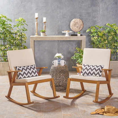 Christopher Knight Home Andy | Outdoor Acacia Wood ocking Chair with Water-Resistant (Set of 2), Teak Finish/Cream Cushion - WoodArtSupply