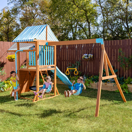 Teamson Kids Wooden Swing Sets for Backyard Outdoor Playset with Slide Rock Wall Trapeze Bar Fireman Pole Pirate Wheel Kids Playground with Swingset Holds 9 Children Ages 3 to 10 Teamson Kids